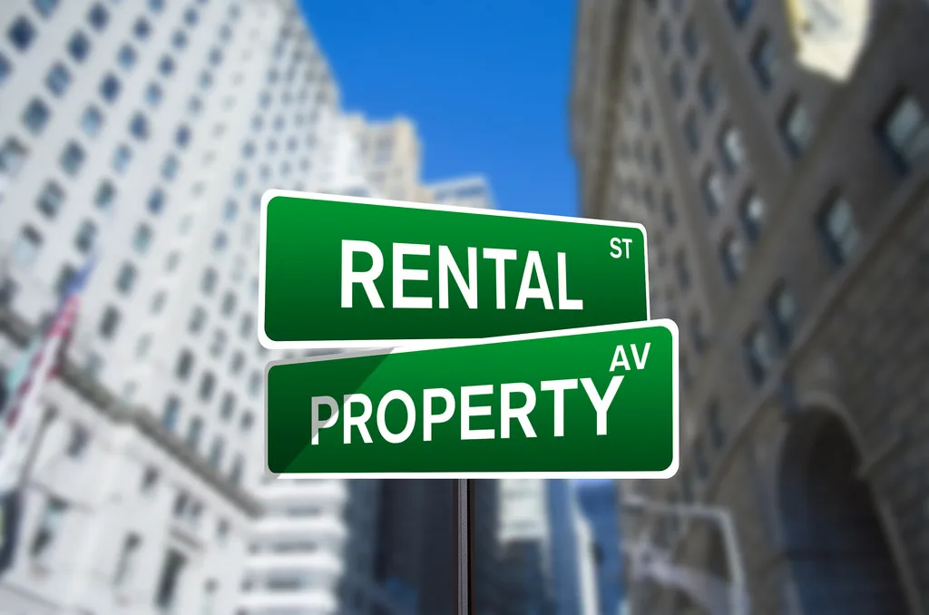 Green street signs reading Rental St and Property Av